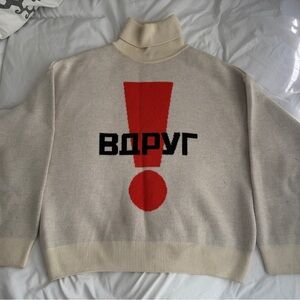 Gosha Rubchinskiy 
Turtleneck Sweater with Red Exclamation Design